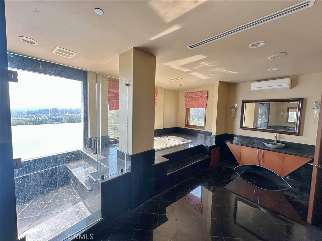 5077 Schumacher Road Calabasas, CA 91302 - Photo 22 of 58 a living room with furniture and a large window