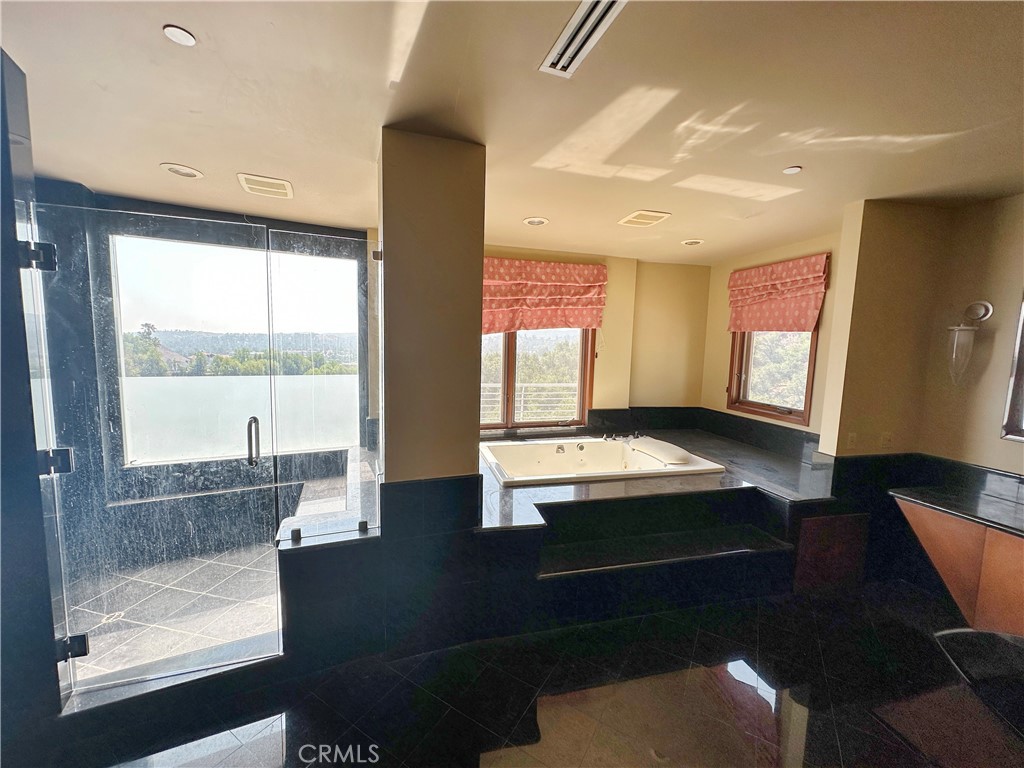 5077 Schumacher Road Calabasas, CA 91302 - Photo 23 of 58 a room with pool table and windows