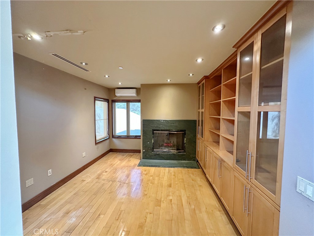 5077 Schumacher Road Calabasas, CA 91302 - Photo 37 of 58 a view of livingroom with hardwood floor and a ceiling fan
