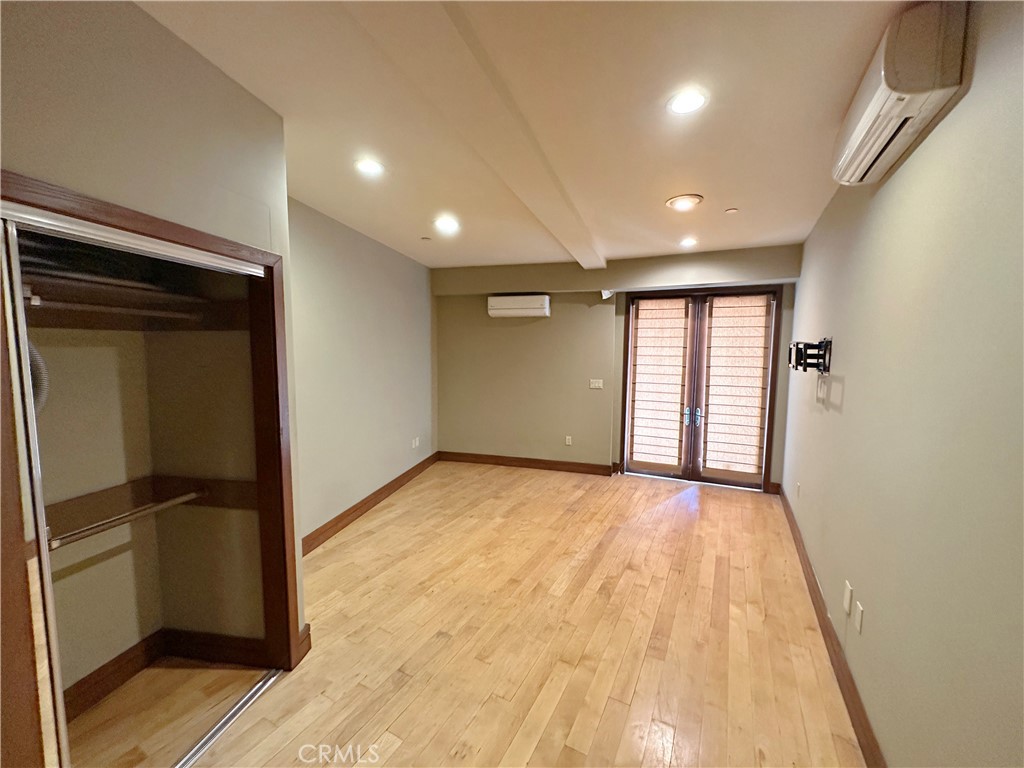 5077 Schumacher Road Calabasas, CA 91302 - Photo 46 of 58 a view of an empty room and window