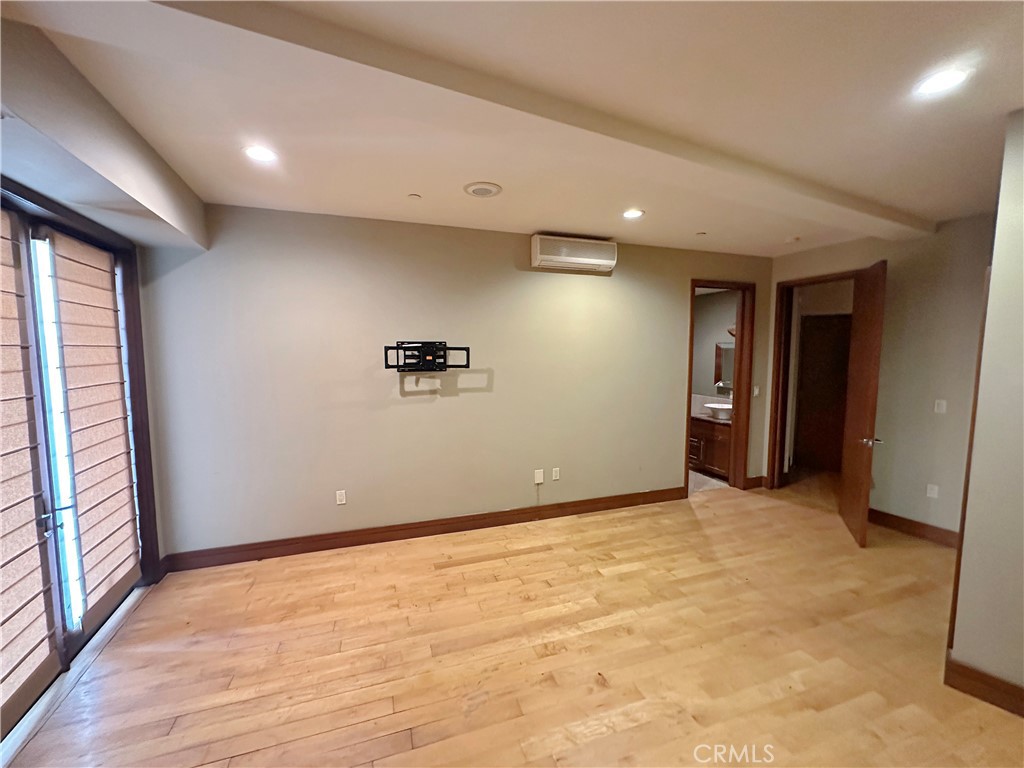 5077 Schumacher Road Calabasas, CA 91302 - Photo 48 of 58 a view of empty room with wooden floor