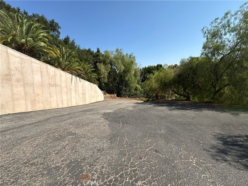 5077 Schumacher Road Calabasas, CA 91302 - Photo 56 of 58 a view of a big yard with large trees