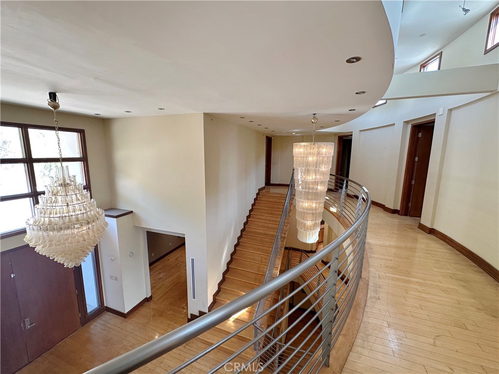 5077 Schumacher Road Calabasas, CA 91302 - Photo 8 of 58 a view of a hallway with furniture