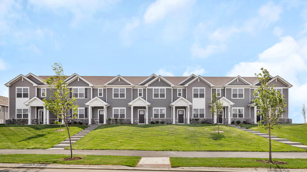2252 Bodega Road Oswego, IL 60543 - Photo 2 of 22 a front view of a residential apartment building with yard