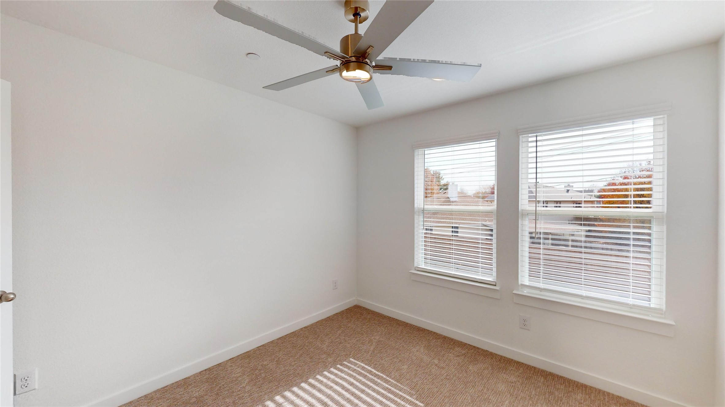 4125 Floyd Alley Grand Prairie, TX 75052 - Photo 28 of 45 a view of an empty room with a window and a ceiling fan
