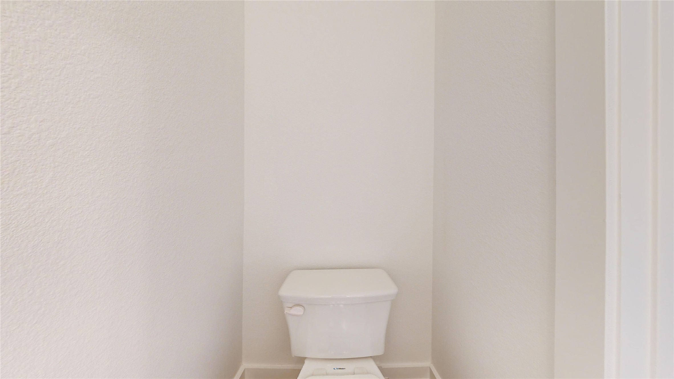 4125 Floyd Alley Grand Prairie, TX 75052 - Photo 33 of 45 a white toilet sitting next to a white wall