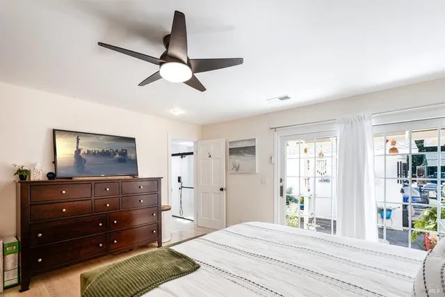 a bedroom with a bed and window