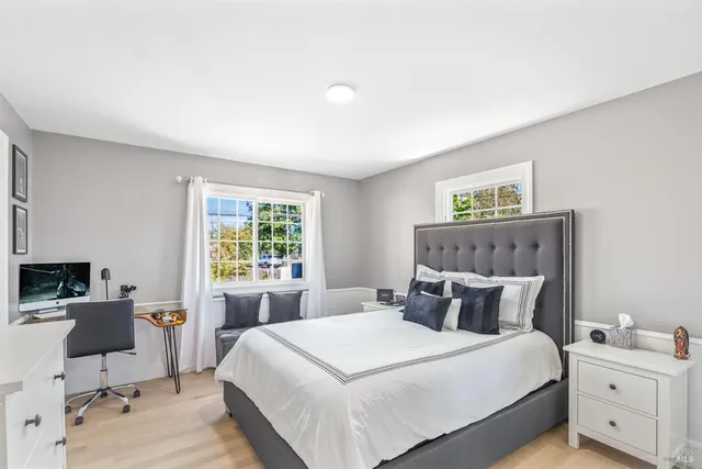 a bathroom with a sink a mirror and shower