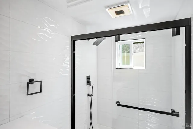 an aerial view of a house with a yard and garden