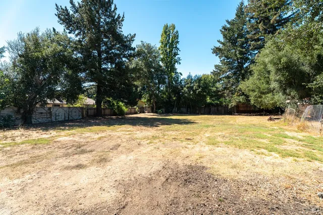 a view of a park with swings and slides
