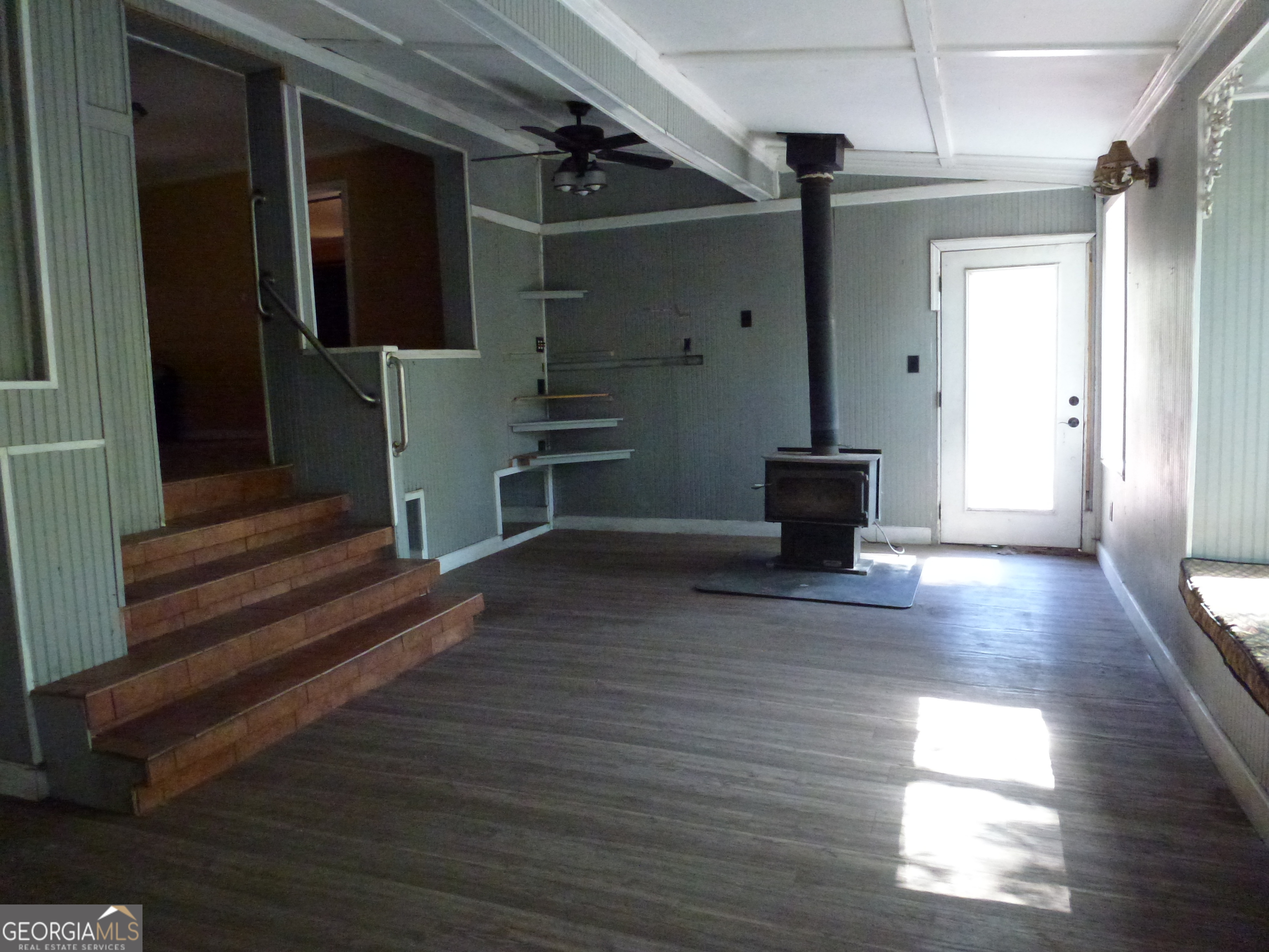 352 Riverside Drive Claxton, GA 30417 - Photo 3 of 25 a view of a hallway with wooden floor and staircase