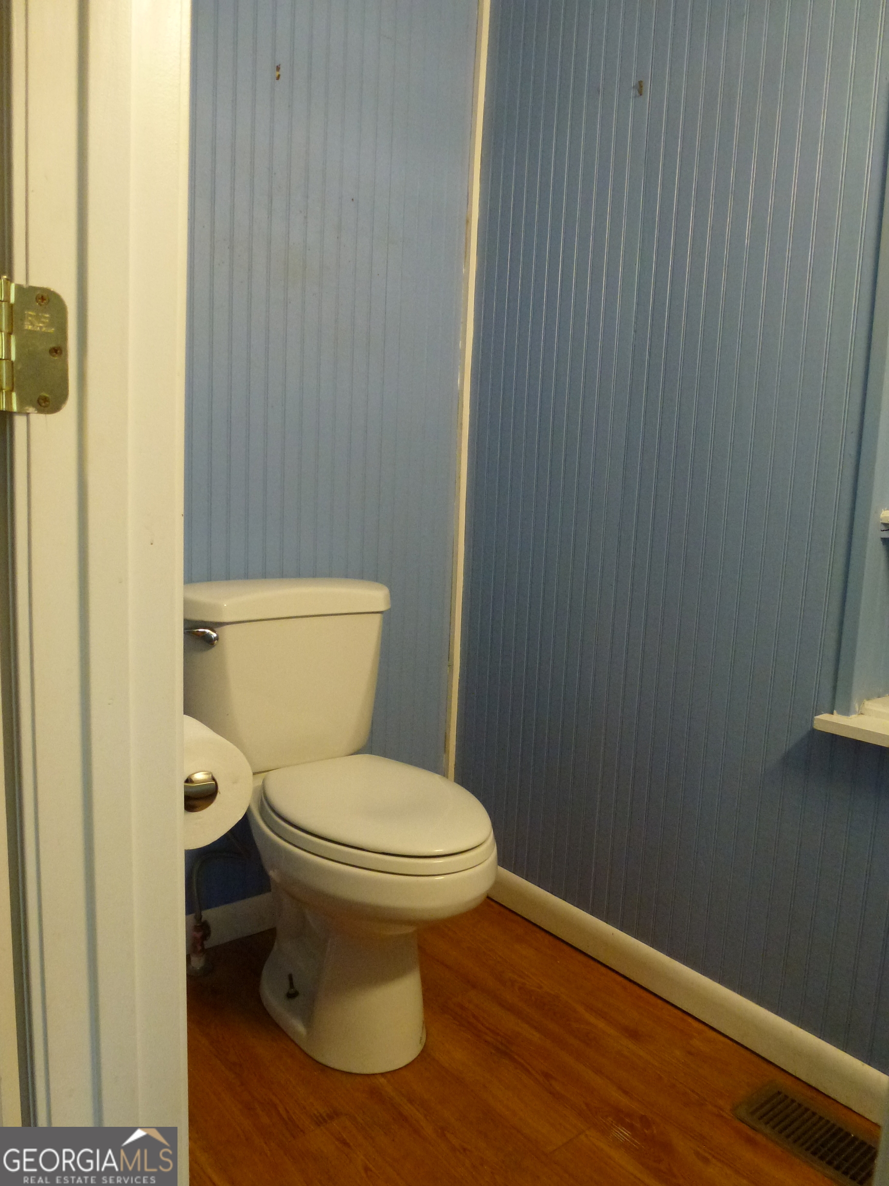 352 Riverside Drive Claxton, GA 30417 - Photo 10 of 25 a white toilet sitting next to a small bathroom