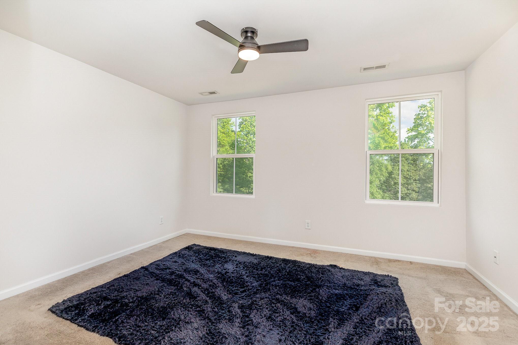 828 Renee Avenue Fort Mill, SC 29715 - Photo 12 of 23 a spacious bedroom with a bed and a window