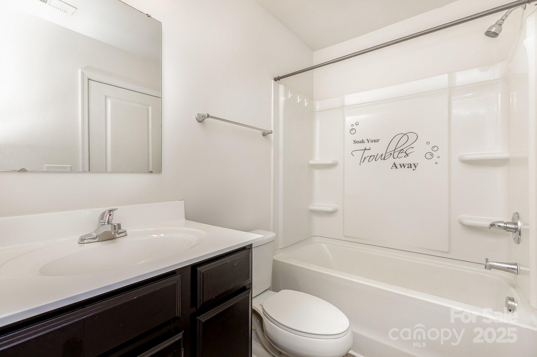 828 Renee Avenue Fort Mill, SC 29715 - Photo 14 of 23 a bathroom with a sink a toilet and shower