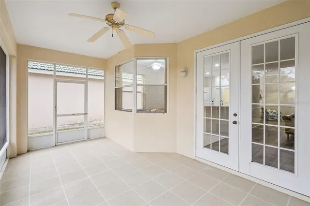 a view of empty room with windows