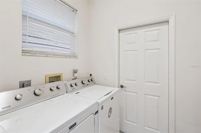 a utility room with a window dryer and washer