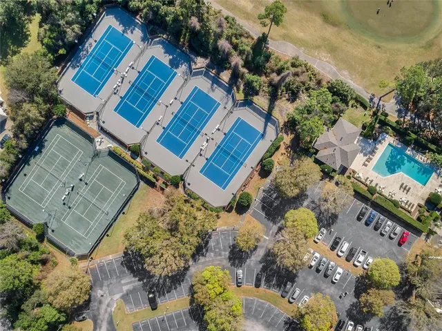 an aerial view of a house with a yard and garden