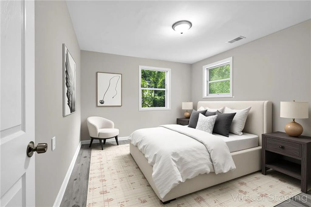 305 South 18th Street Griffin, GA 30224 - Photo 14 of 36 a bedroom with bed and window