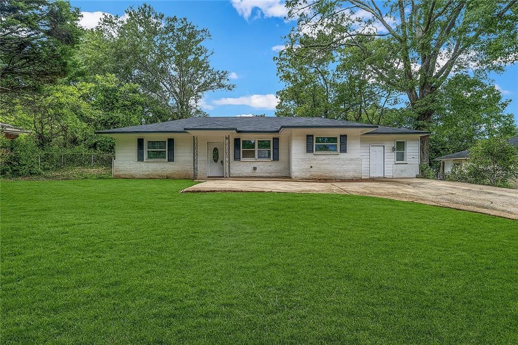 305 South 18th Street Griffin, GA 30224 - Photo 19 of 36 a house view with a garden space