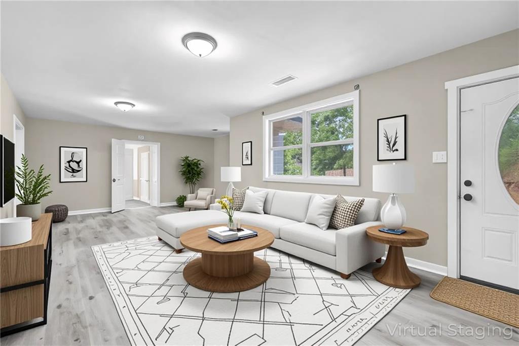 305 South 18th Street Griffin, GA 30224 - Photo 2 of 36 a living room with furniture and a large window