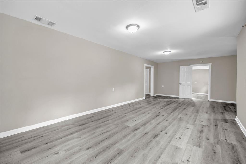 305 South 18th Street Griffin, GA 30224 - Photo 23 of 36 a view of an empty room and wooden floor