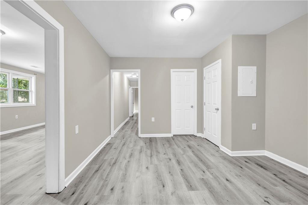305 South 18th Street Griffin, GA 30224 - Photo 27 of 36 wooden floor in an empty room with a window