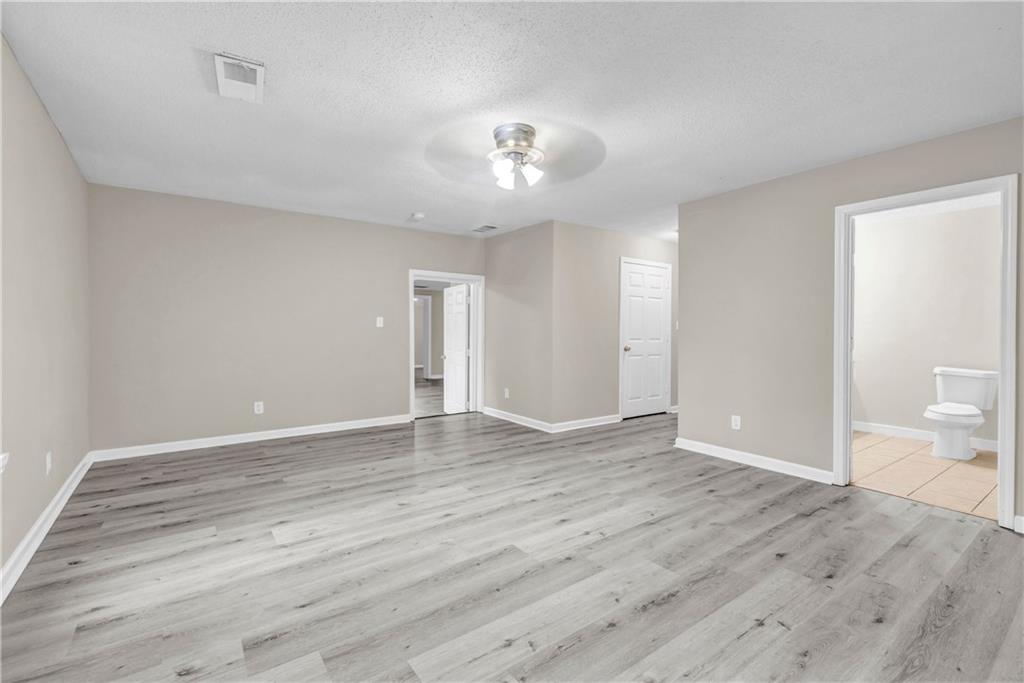 305 South 18th Street Griffin, GA 30224 - Photo 33 of 36 wooden floor in an empty room with a window