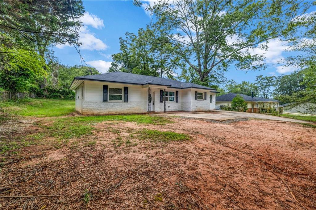 305 South 18th Street Griffin, GA 30224 - Photo 35 of 36 a front view of house with yard and green space