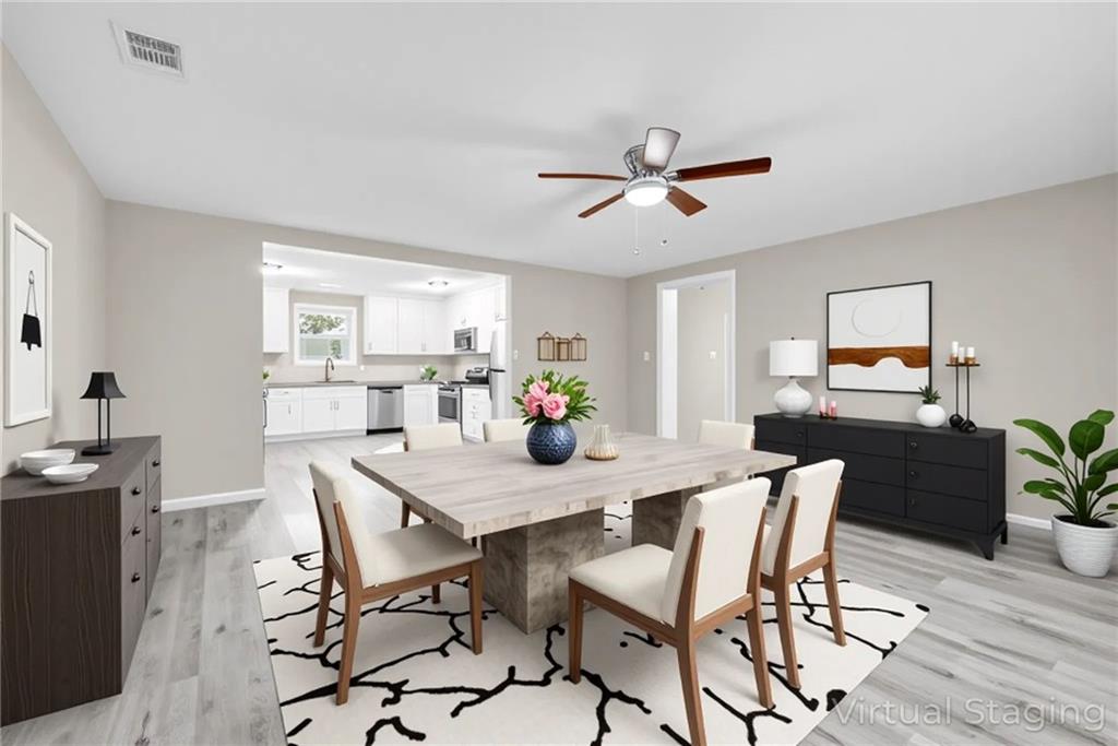 305 South 18th Street Griffin, GA 30224 - Photo 4 of 36 a view of a dining room with furniture