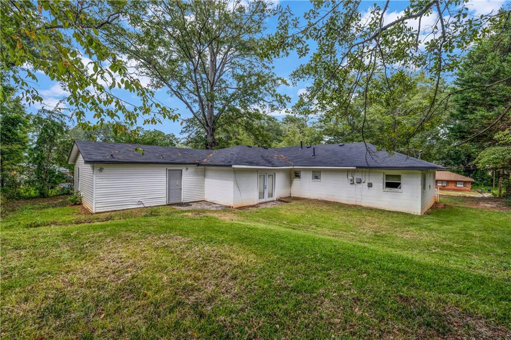 305 South 18th Street Griffin, GA 30224 - Photo 8 of 36 a view of a house with a yard