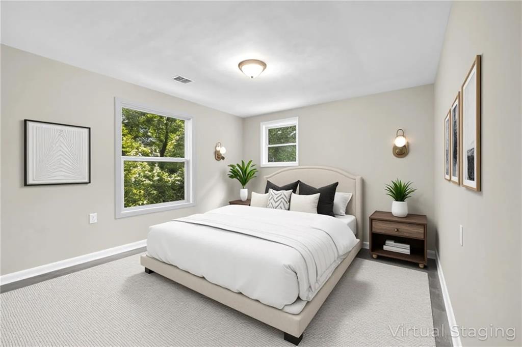 305 South 18th Street Griffin, GA 30224 - Photo 10 of 36 a spacious bedroom with a bed and a window