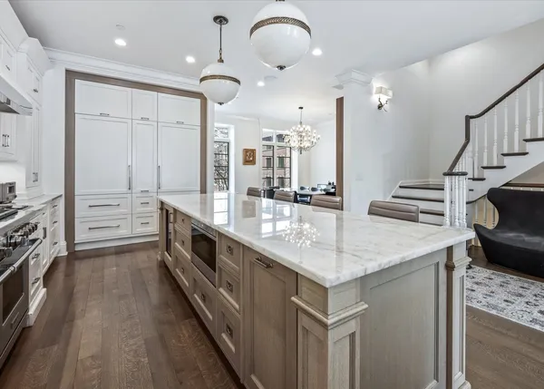 a kitchen with counter top space sink and stove