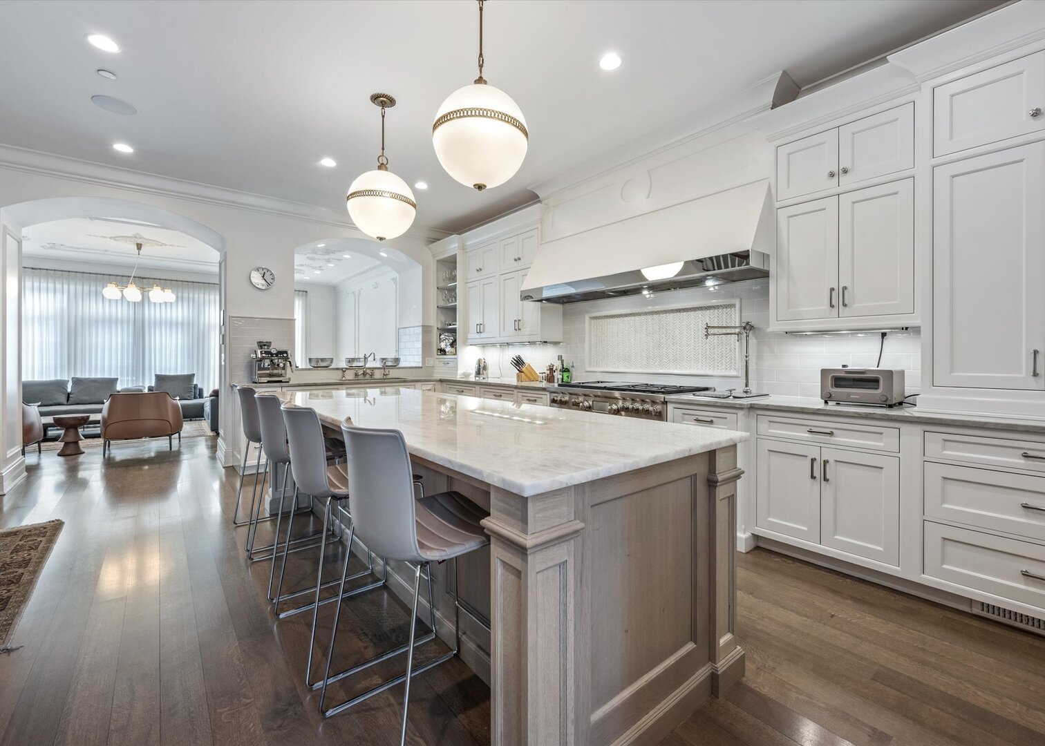 441 West Deming Place Chicago, IL 60614 - Photo 13 of 54 a kitchen with stainless steel appliances kitchen island granite countertop a table chairs and a cabinets