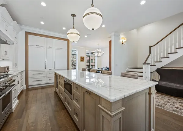 a kitchen with granite countertop a stove and a sink