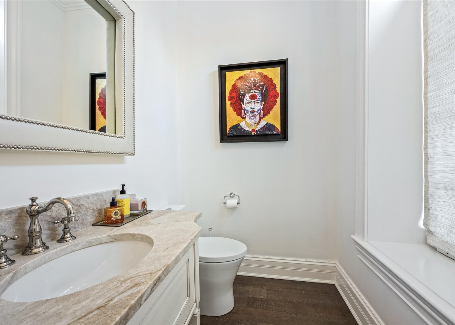 441 West Deming Place Chicago, IL 60614 - Photo 19 of 54 a bathroom with a granite countertop sink and a painting on the wall