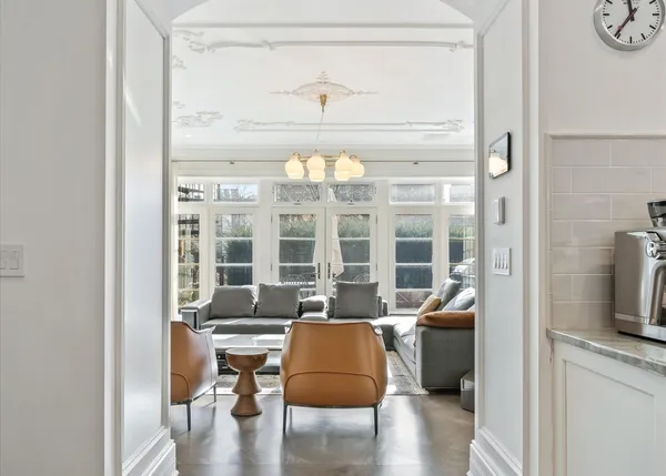 a living room with fireplace furniture and a flat screen tv