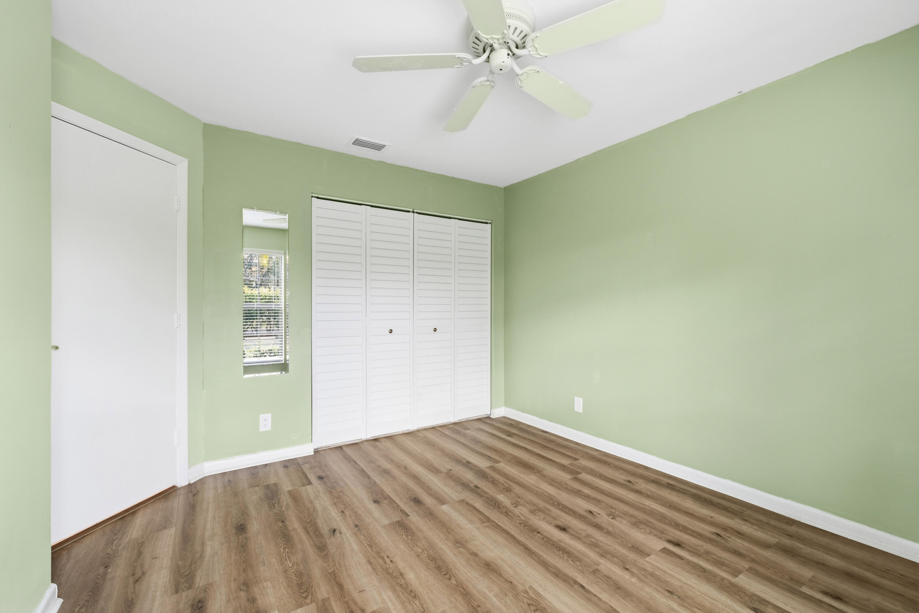 3233 Perimeter Drive, Unit 2511 Greenacres, FL 33467 - Photo 16 of 39 a view of empty room with wooden floor