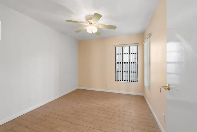 a view of an empty room with a window