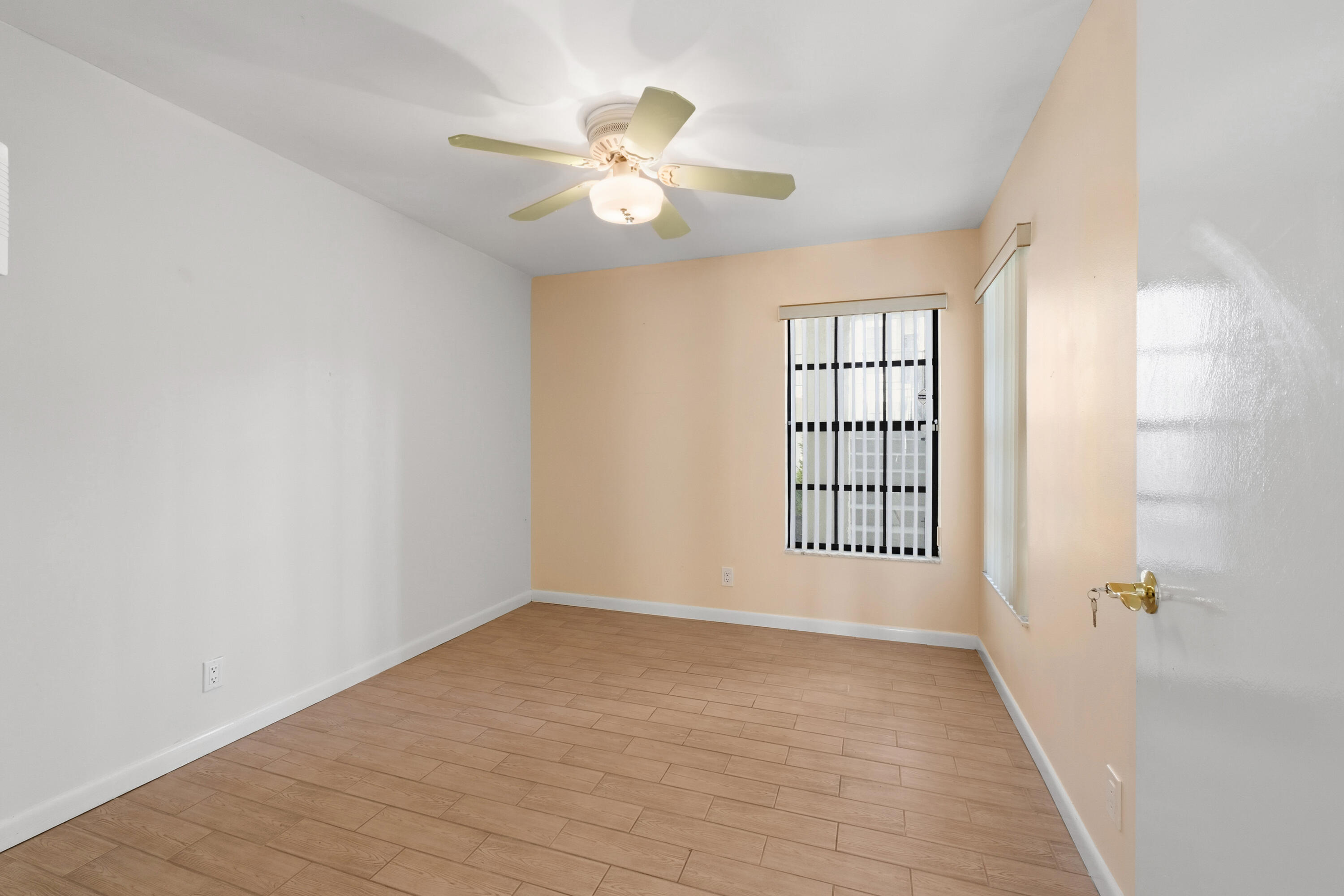 3233 Perimeter Drive, Unit 2511 Greenacres, FL 33467 - Photo 19 of 39 a view of an empty room with a window