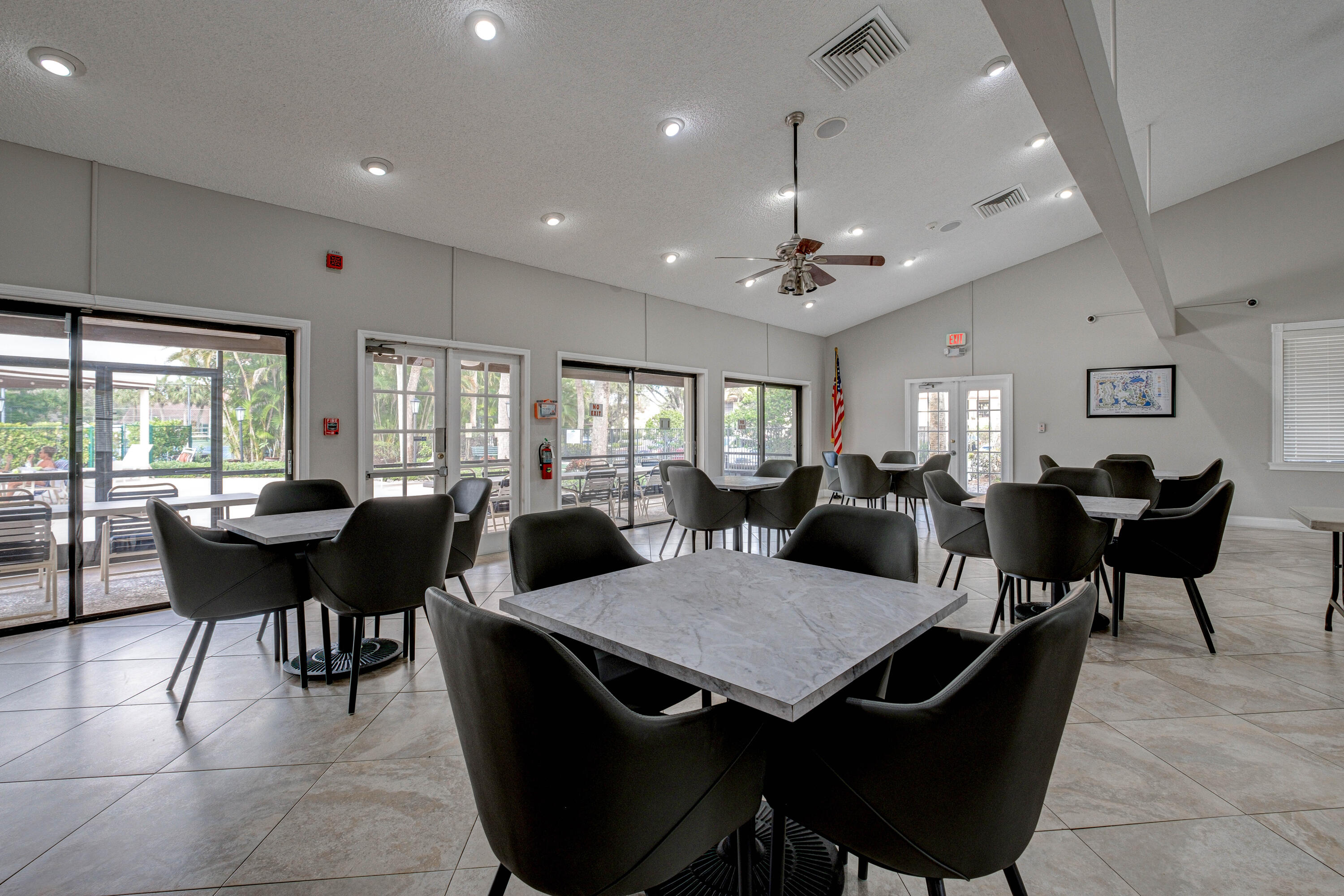 3233 Perimeter Drive, Unit 2511 Greenacres, FL 33467 - Photo 24 of 39 a view of a dining room with furniture