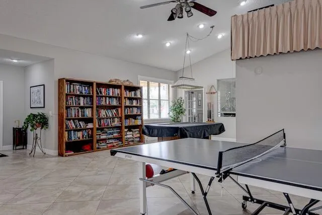 a view of a livingroom with furniture and book shelf