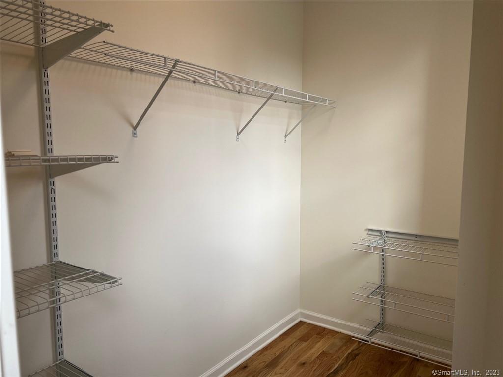 73 West Main Street, Unit 5 Clinton, CT 06413 - Photo 18 of 23 a view of a room with racks on the wall