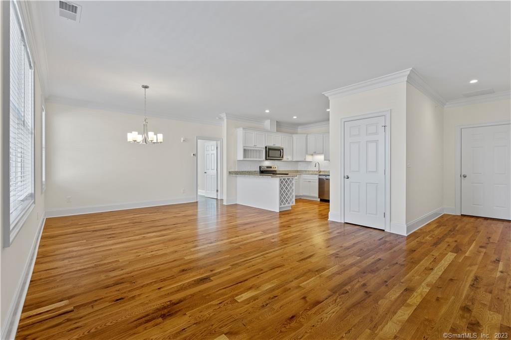 73 West Main Street, Unit 5 Clinton, CT 06413 - Photo 2 of 23 a view of kitchen with wooden floor