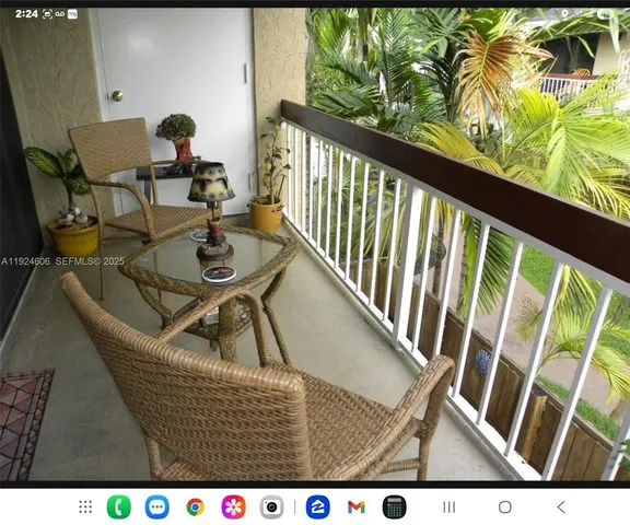 a view of a room with furniture and a window