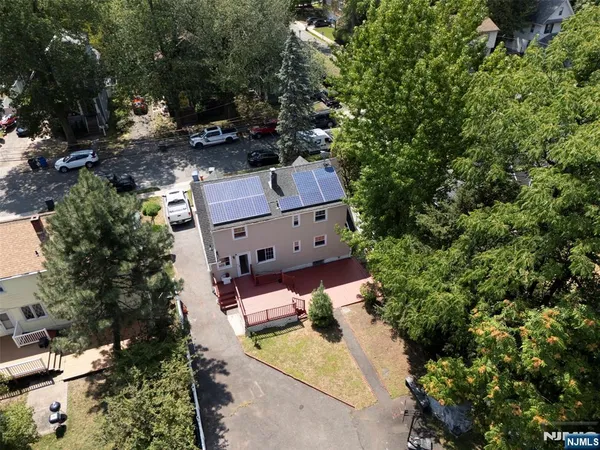 an aerial view of a house with outdoor space