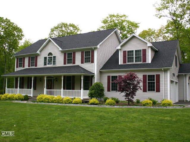 6 Winton Farm Road Newtown, CT 06470 - Photo 1 of 1 a front view of a house with a yard