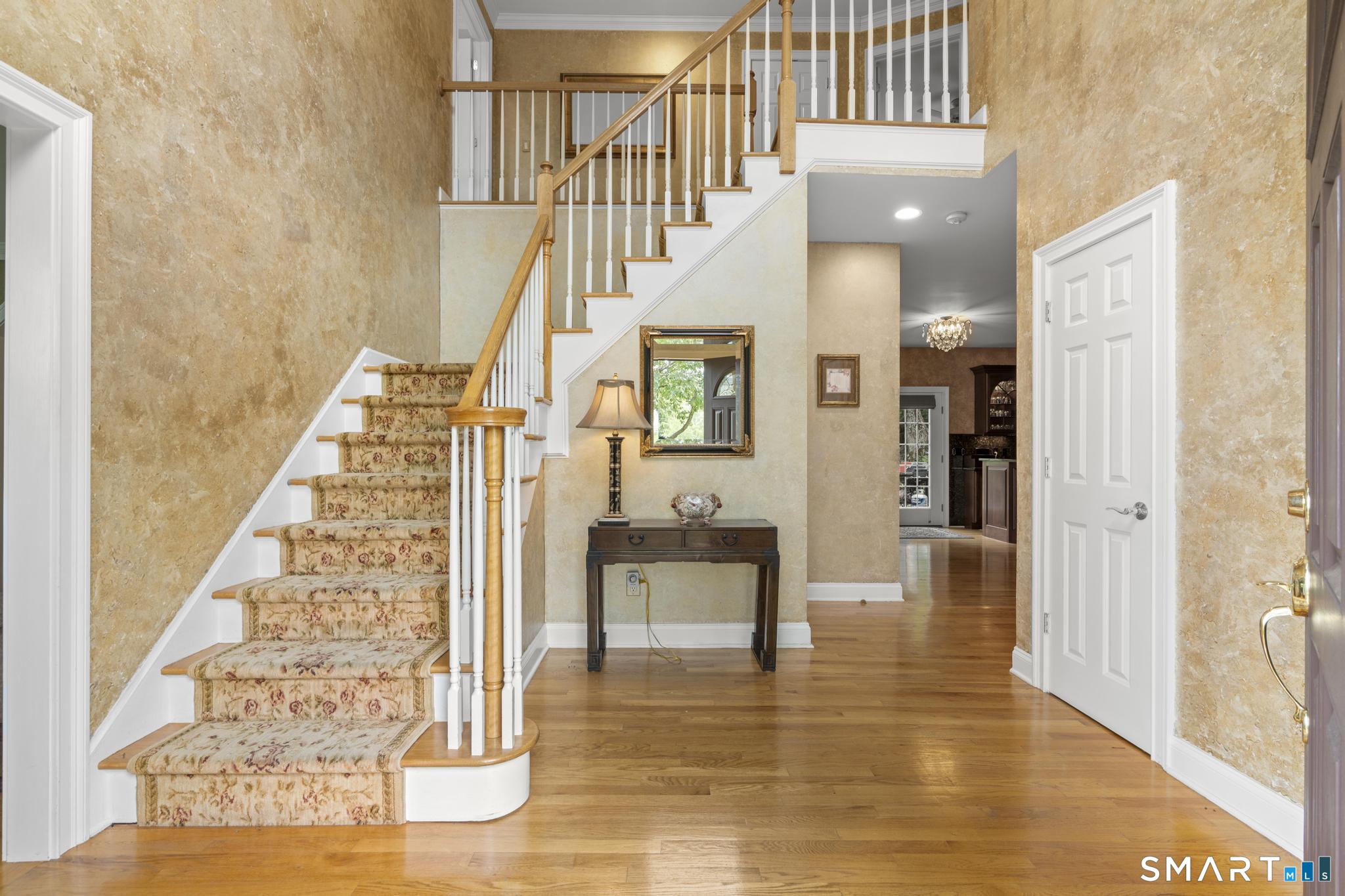 12 Logans Way Danbury, CT 06811 - Photo 18 of 40 a view of entryway and hall with wooden floor