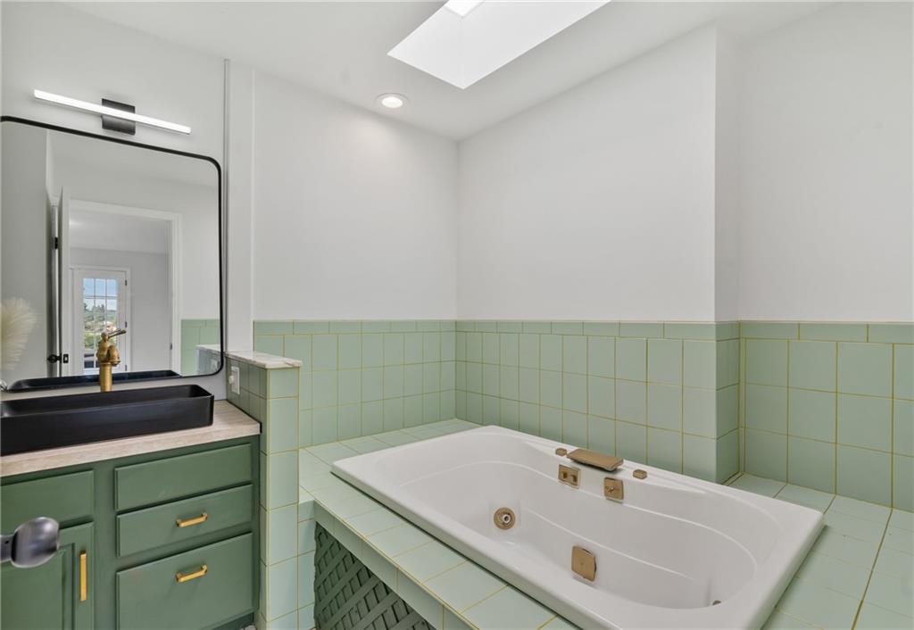 1017 McCoy Road McKees Rocks, PA 15136 - Photo 17 of 30 a bathroom with a sink and a mirror