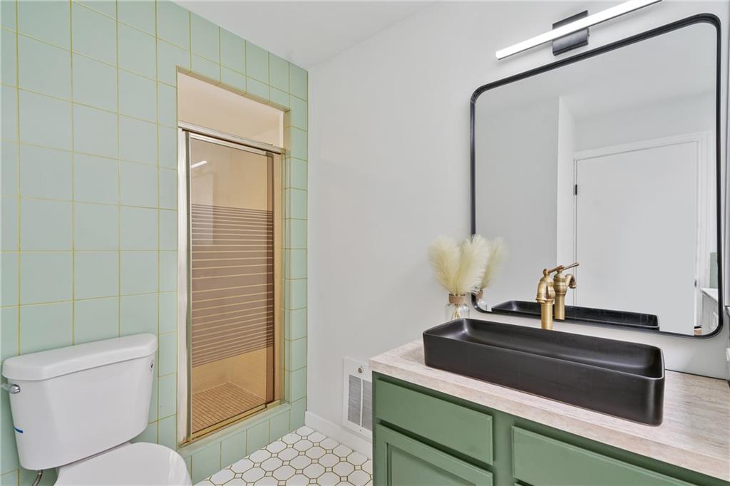 1017 McCoy Road McKees Rocks, PA 15136 - Photo 18 of 30 a bathroom with a sink a toilet and shower