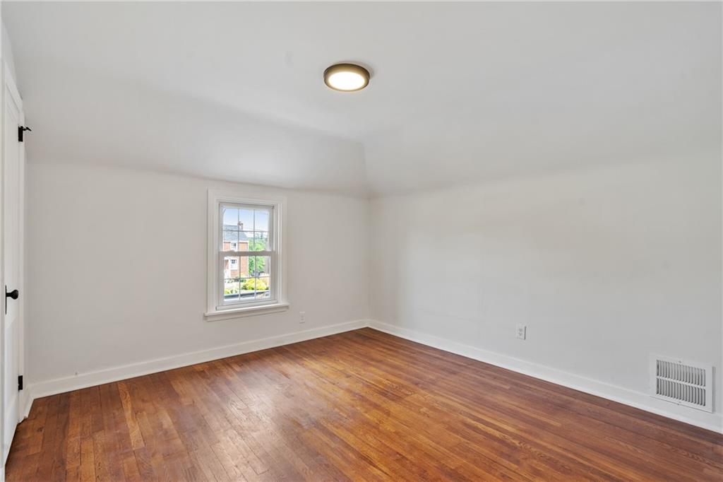 1017 McCoy Road McKees Rocks, PA 15136 - Photo 20 of 30 wooden floor in an empty room with a window
